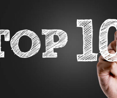 Hand writing the text: Top 10